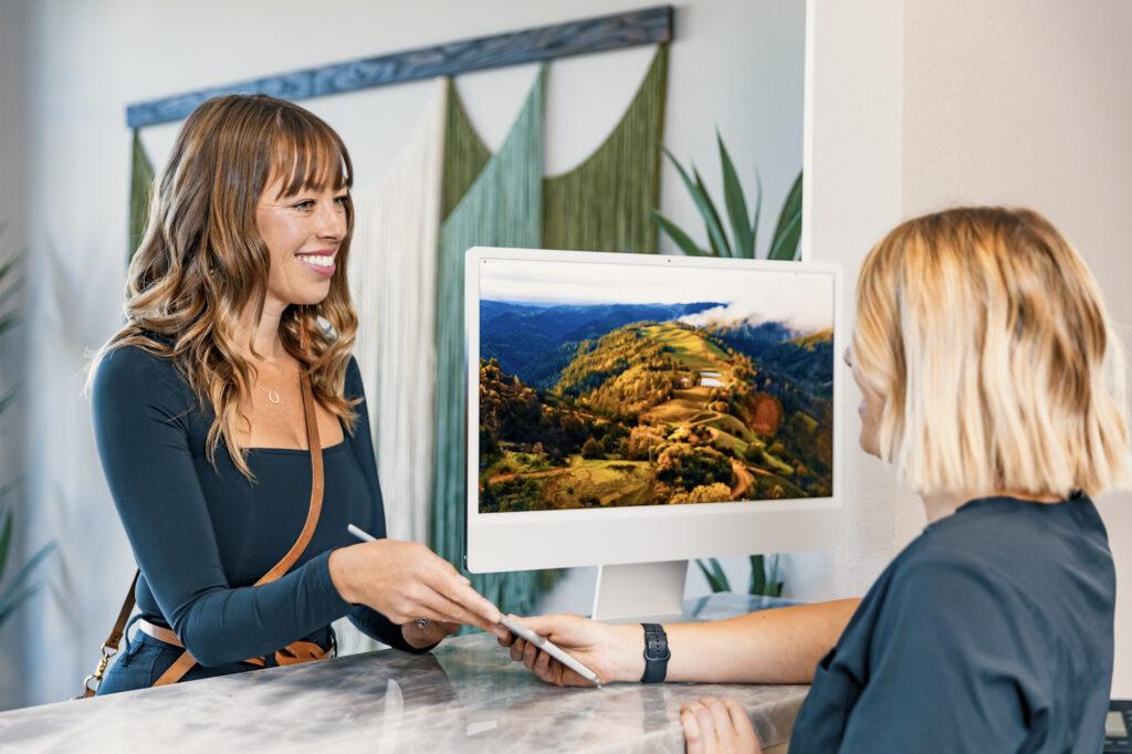 A patient checks in at Alpine Wellness's front desk for concierge primary care in Reno.